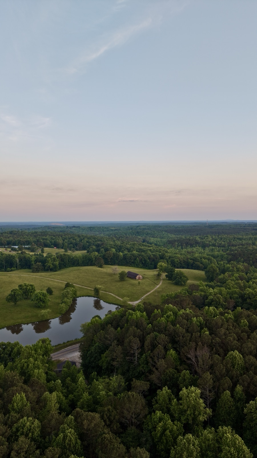 Twilight over North Georgia farmland with pond